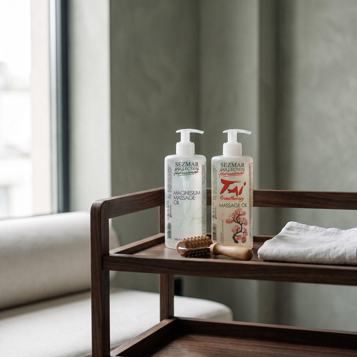 Magnesium and Tai massage oils 500 ml with a wooden massage roller on a trolley