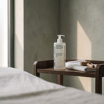 Sezmar Collection Professional Magnesium Massage Oil 500 ml on a wooden trolley in a treatment room