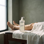 Magnesium Massage Oil 500 ml on a massage couch